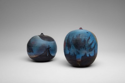 Two squat blue porcelain vessels.