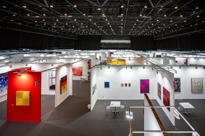 Aerial view of an empty art fair with various booths shown.