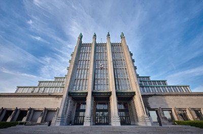 A photo featuring the front of Brussels Expo, an Art Deco structure built in 1935.