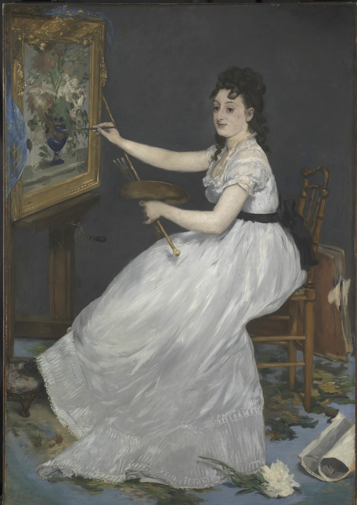 A brushy painting of a seated white woman painting a still life of flowers in a vase. Her flowing white dress tumbles across her legs. At her feet is a sole white rose.