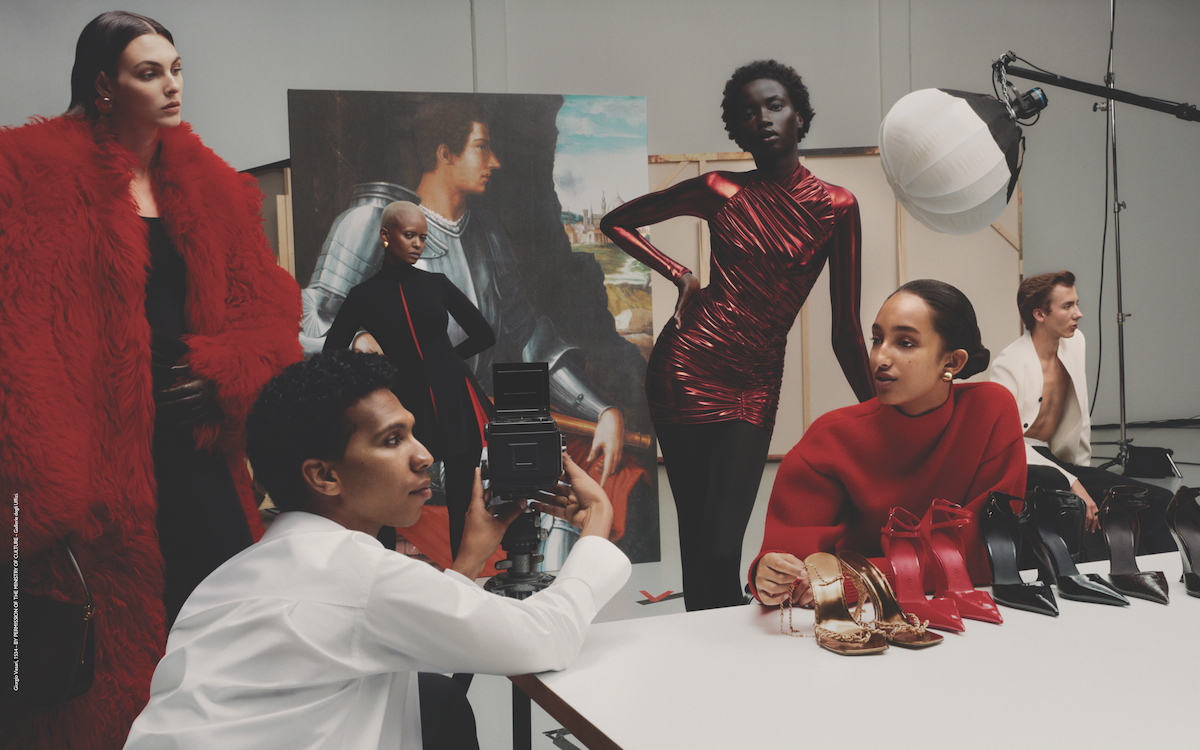 A photo of models in red and white clothes being photographed by Tyler Mitchell.