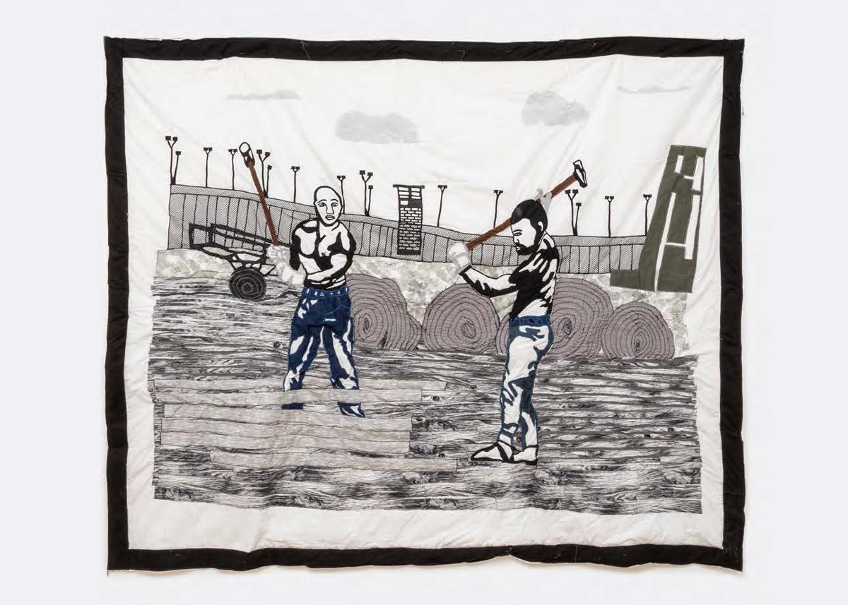 A quilt showing two shirtless men working in a prison yard.