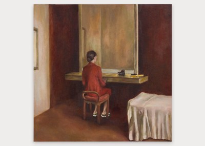 A painting showing a woman in red sitting at a vanity in front of a large mirror that does not show her reflection.