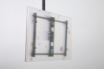 A translucent material hangs from the ceiling via TV mounting hardware.