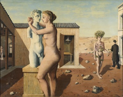A painting of a nude woman hugging a sculpture of a nude man. Nearby her, a nude woman with a flower in front of her walks amid rocky terrain as a man in a bowler hat and a trench coat passes beside her. Around them are nondescript buildings.