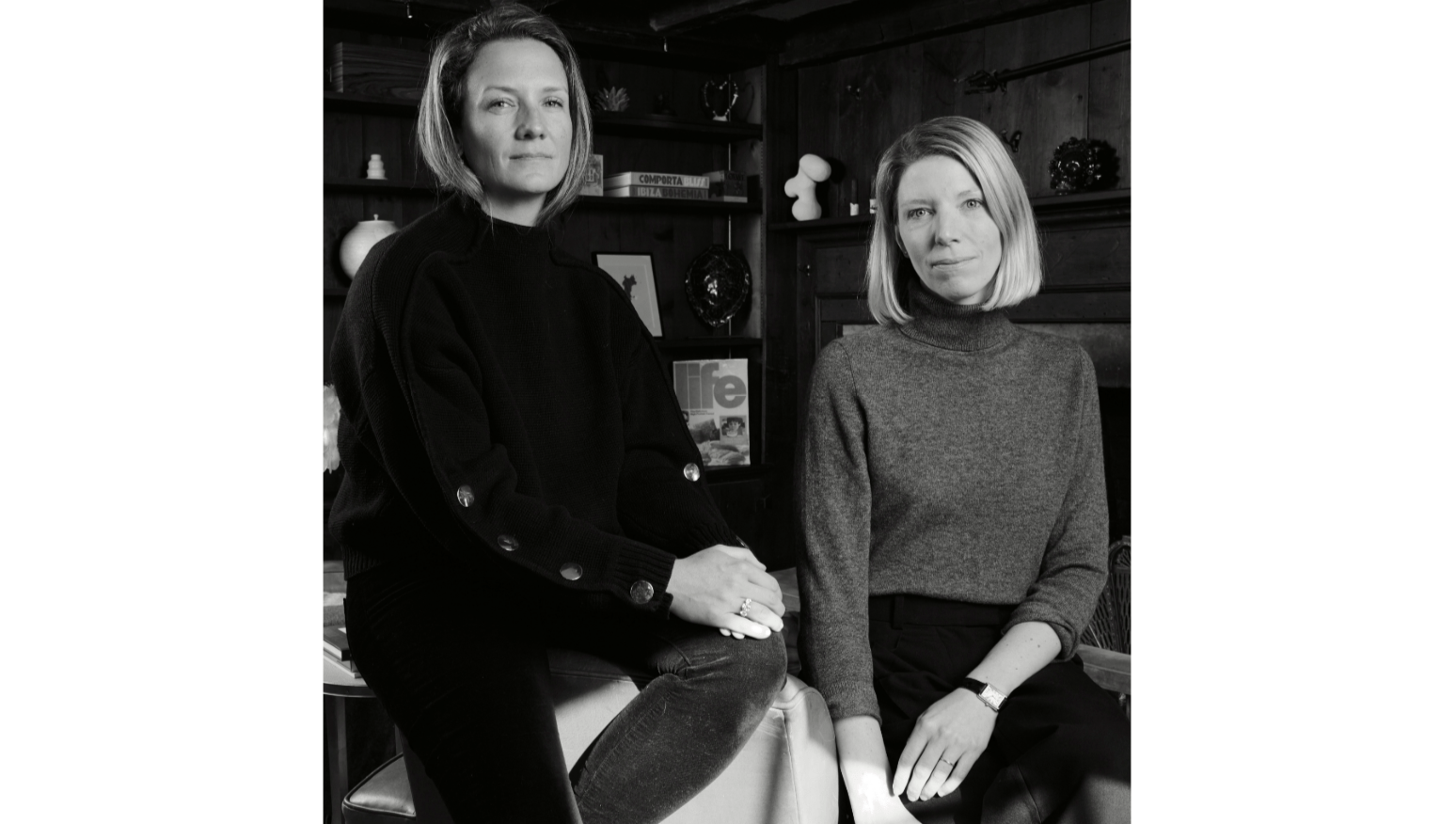 a black and white image of two women.